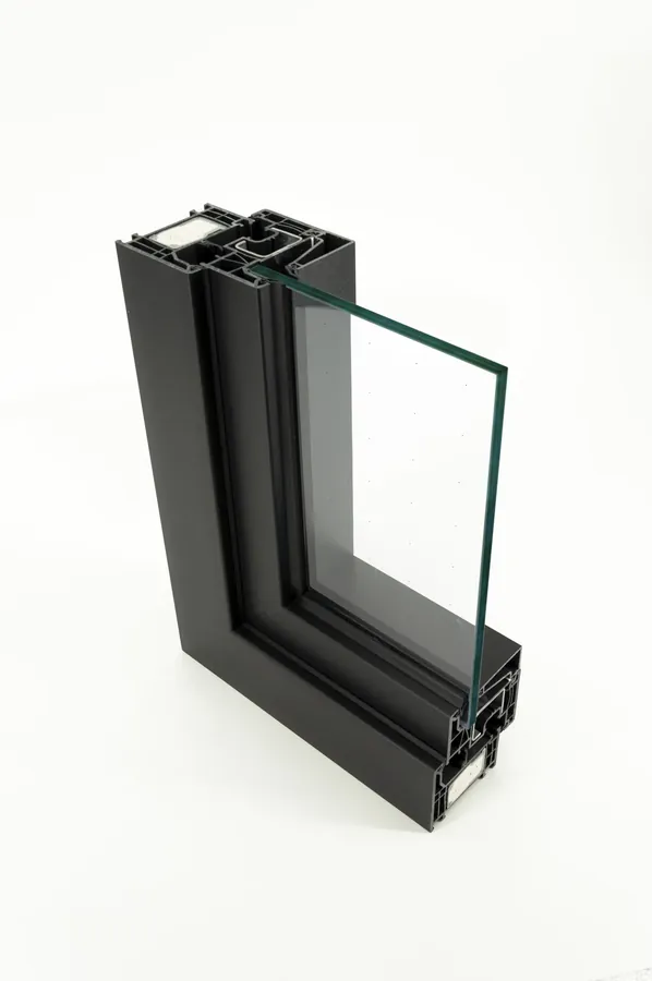 Corner section of a Deceuninck PVC window frame, anthracite profiles and double glazing