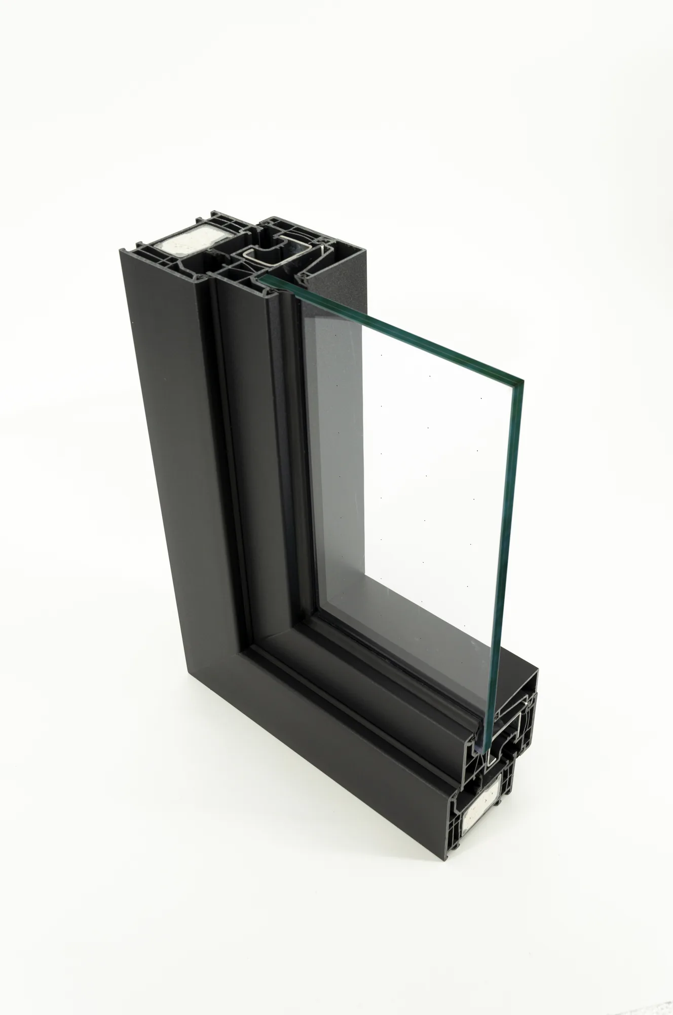 Corner section of a Deceuninck PVC window frame, anthracite profiles and double glazing