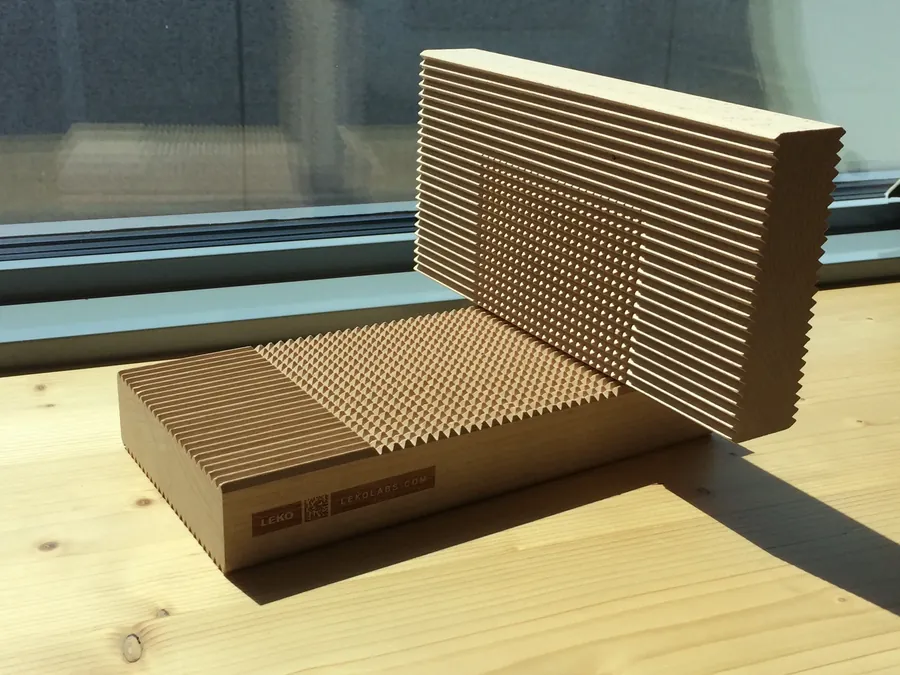 Leko Labs sample of timber with notched lamellas, resting on a window sill