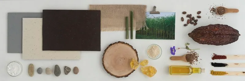 Les matières premières du linoléum réunies à plat : huile de lin, farine de bois, jute, résine
